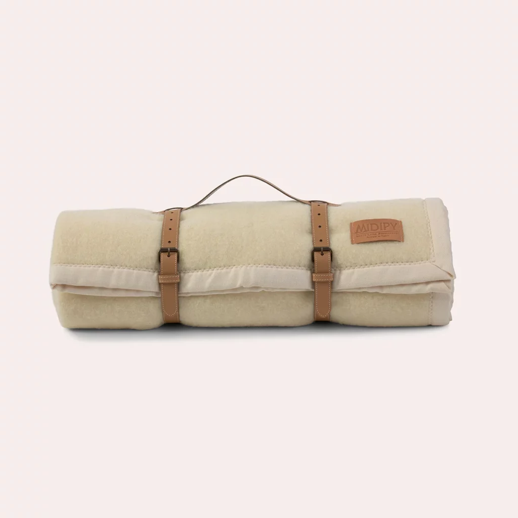 Plaid en laine artisanal coloris Ivoire et sangle Camel